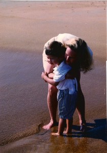 my holding Christian at the waves at Bethany